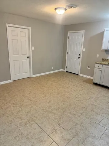 a large kitchen with a stove a sink dishwasher and a refrigerator