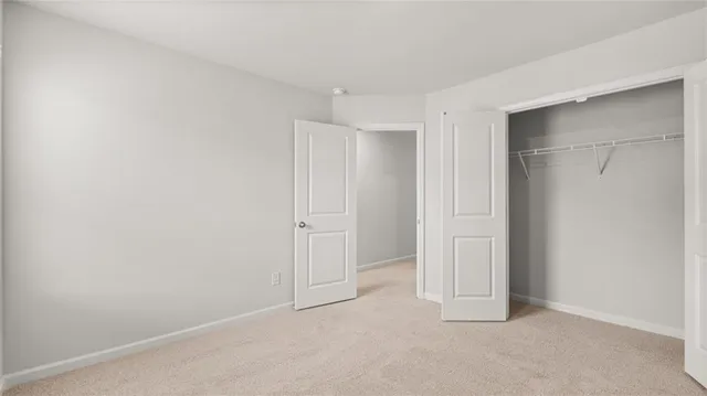 a bathroom with a granite countertop sink and mirror with bathtub