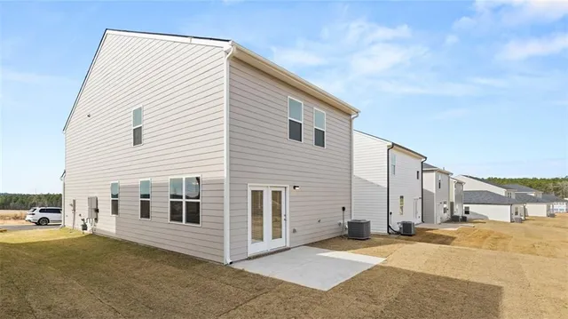a view of a house with a backyard