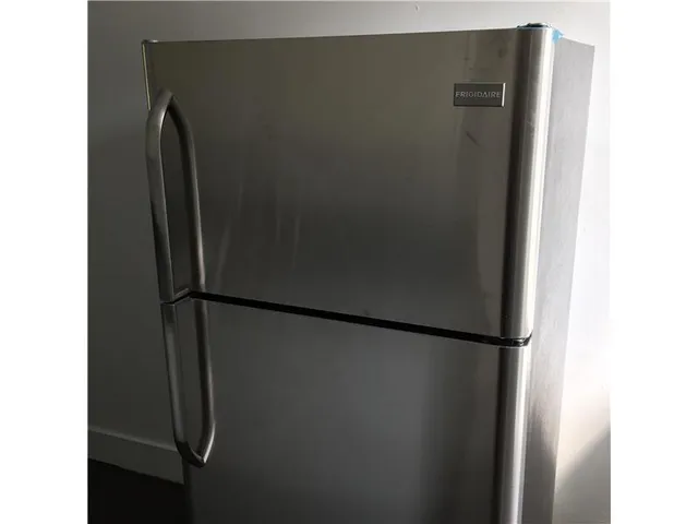 a view of an empty room and a window