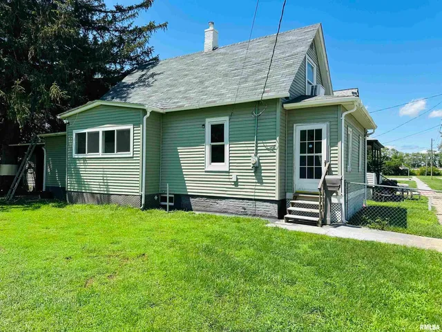 a front view of a house with yard