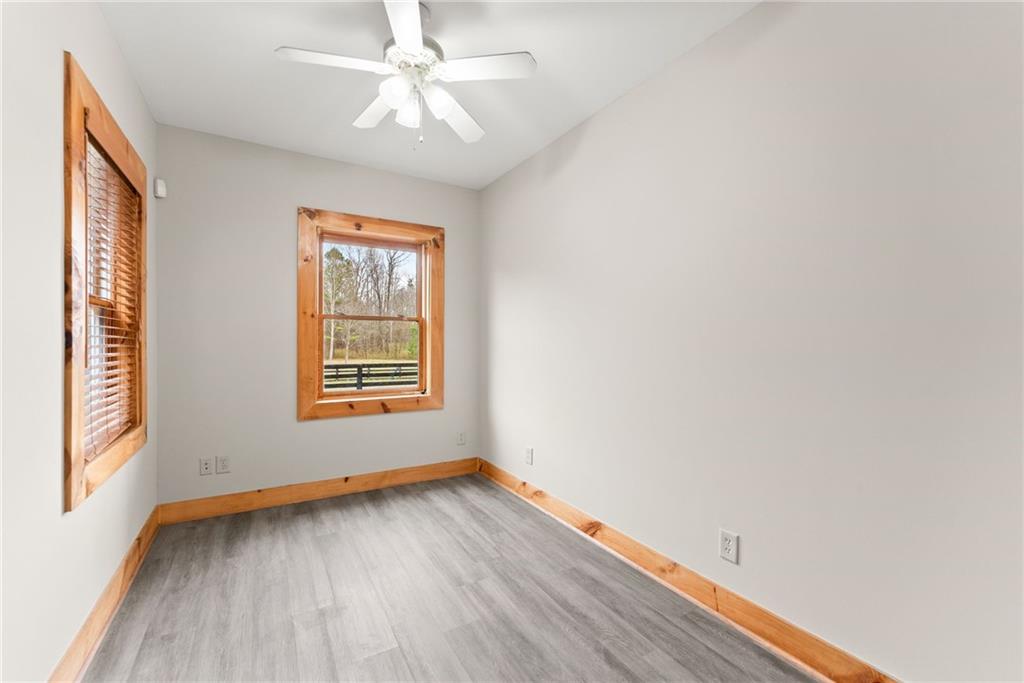 40 Benton Road Jefferson, GA 30549 - Photo 48 of 73 a view of an empty room with wooden floor and a window