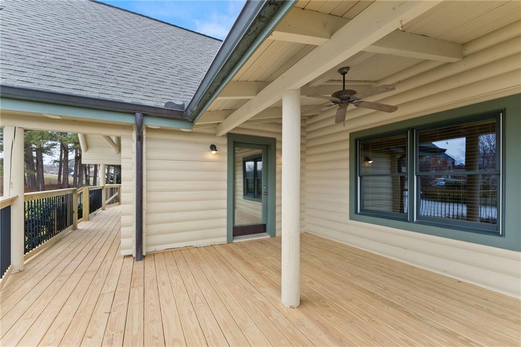 40 Benton Road Jefferson, GA 30549 - Photo 57 of 73 a view of a patio with table and chairs with wooden floor