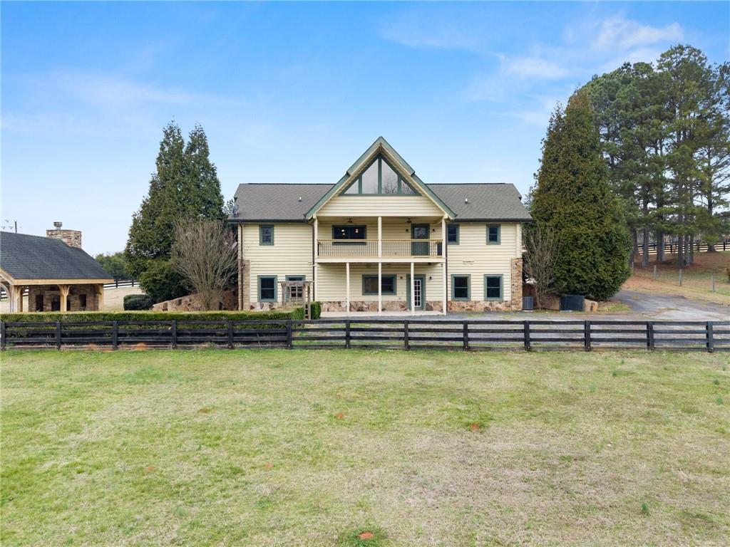 40 Benton Road Jefferson, GA 30549 - Photo 61 of 73 a view of a swimming pool with couches chairs and a table and chairs