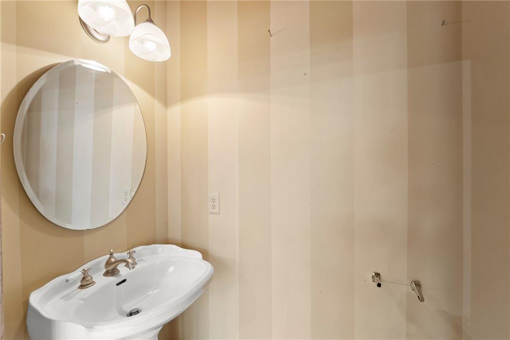 40 Benton Road Jefferson, GA 30549 - Photo 8 of 73 a bathroom with a sink and a mirror