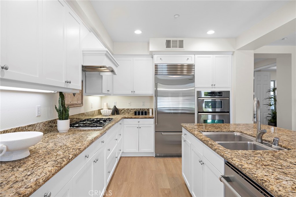 47 Tuscany Ladera Ranch, CA 92694 - Photo 5 of 28 a kitchen with stainless steel appliances granite countertop a sink stove and refrigerator