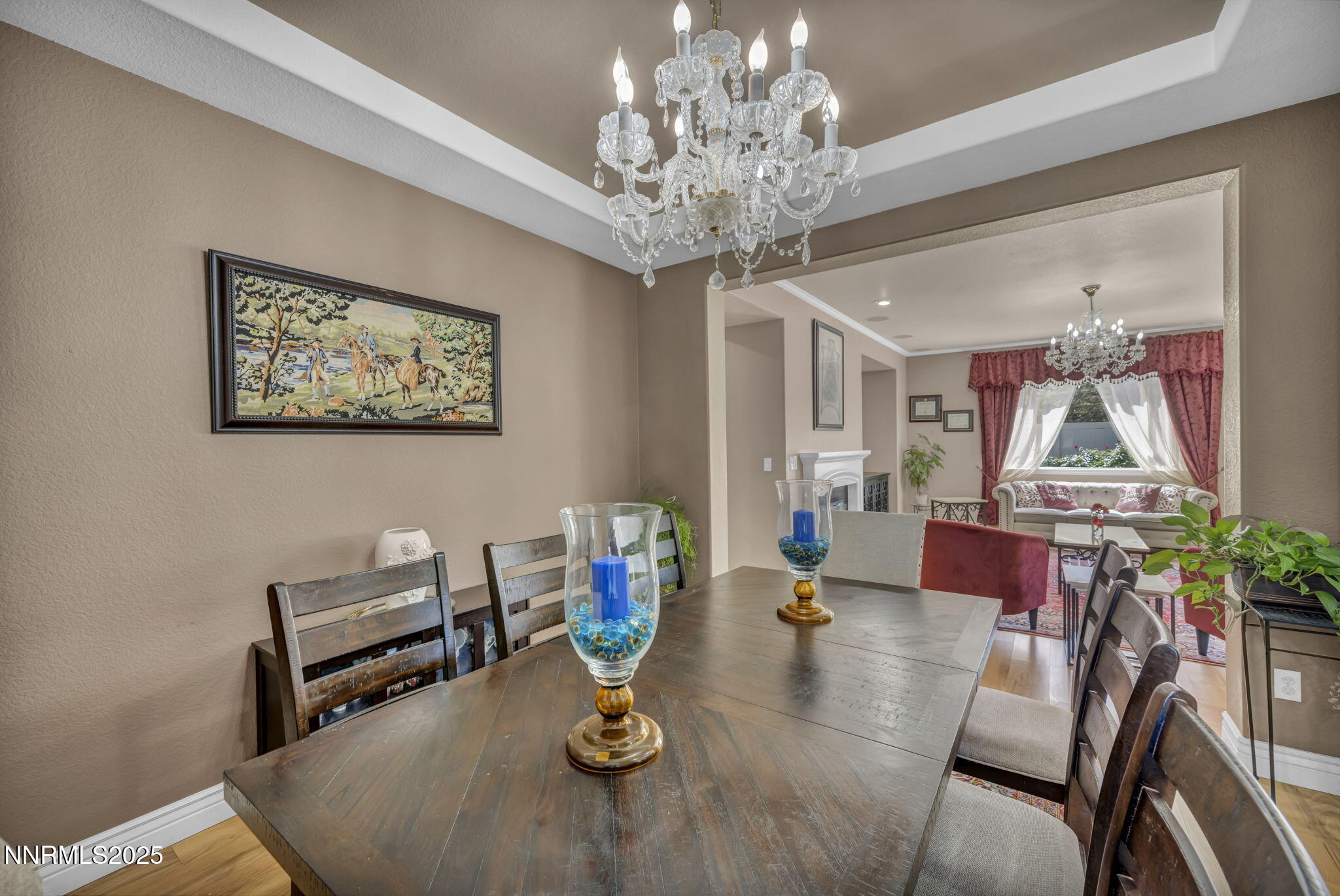 10598 Fort Morgan Way Reno, NV 89521 - Photo 29 of 62 a living room with furniture and a chandelier