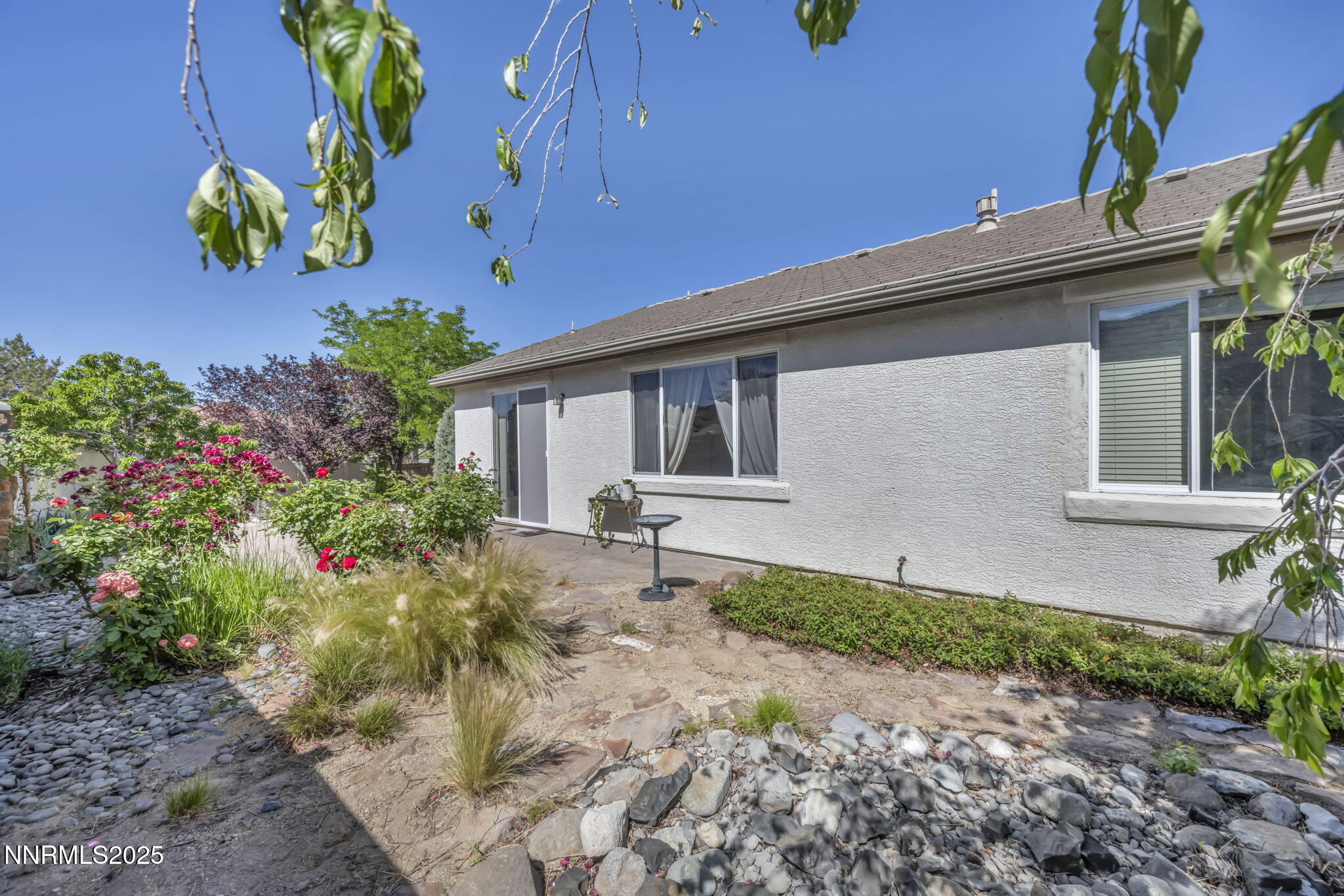 10598 Fort Morgan Way Reno, NV 89521 - Photo 54 of 62 a front view of a house with a yard