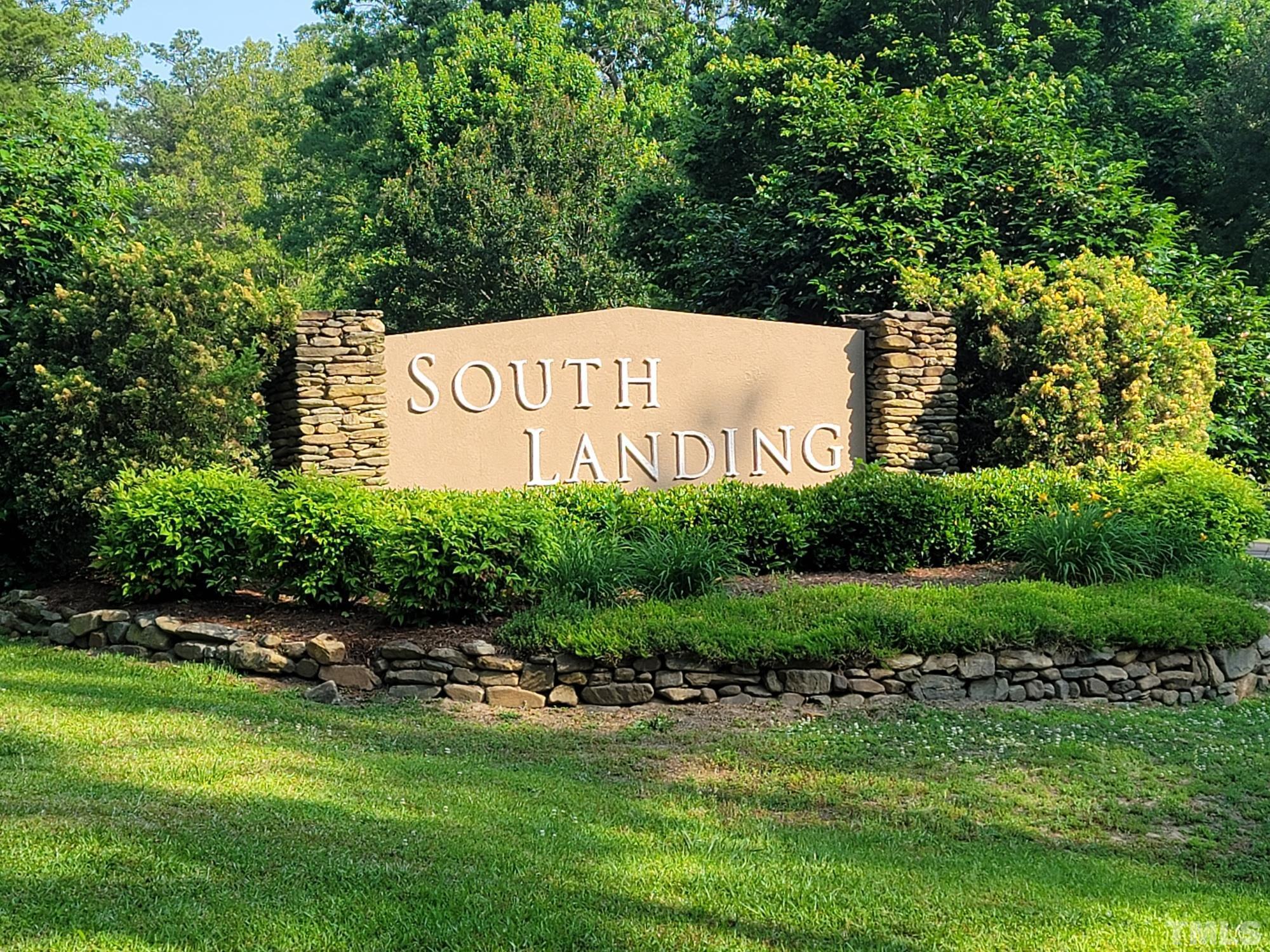 2058 Cedar Circle Sanford, NC 27332 - Photo 2 of 14 a sign of golf club on a wall under a tree