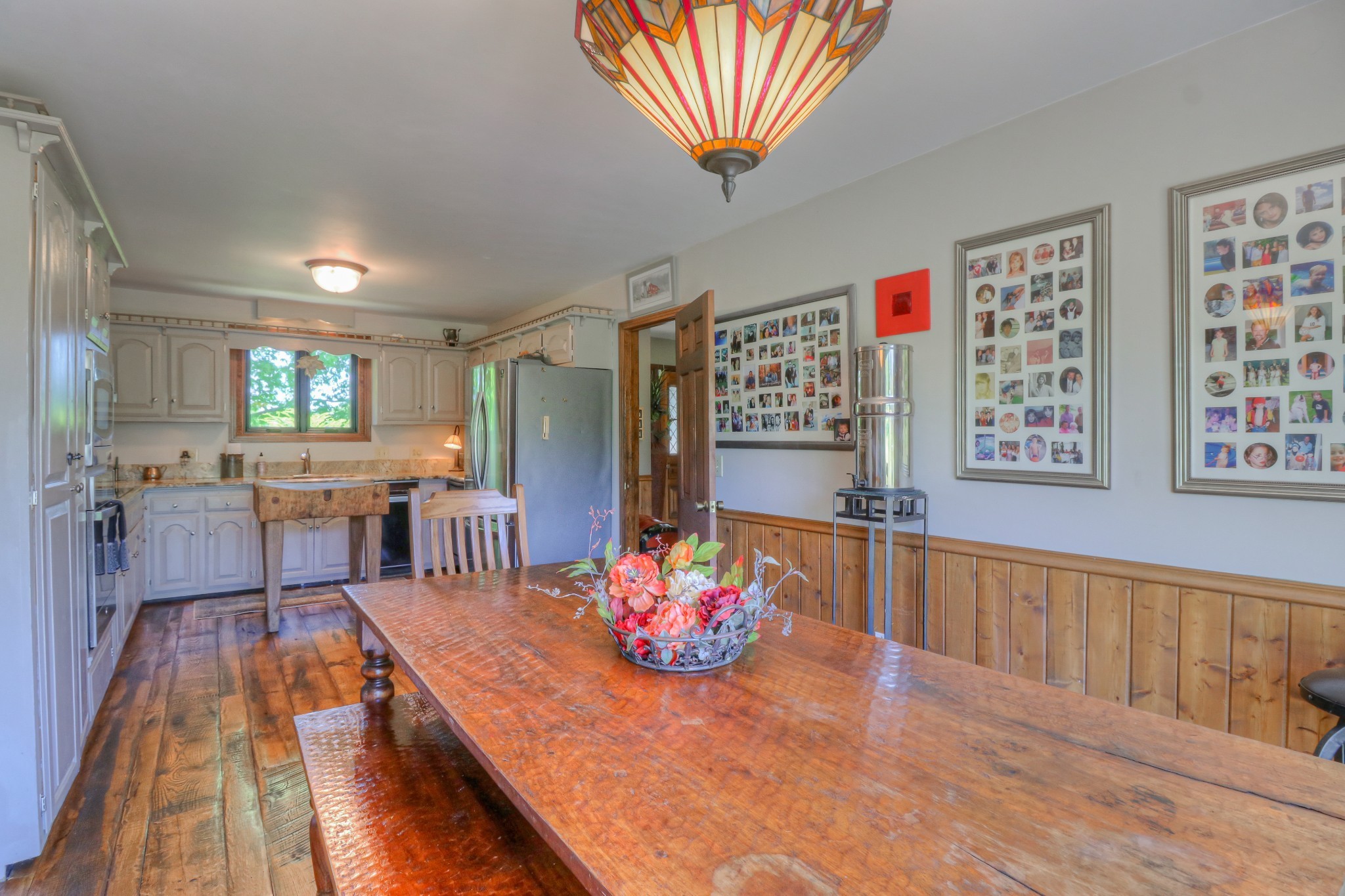 7308 Walker Road Fairview, TN 37062 - Photo 11 of 36 a living room with furniture dining table and a wooden floor
