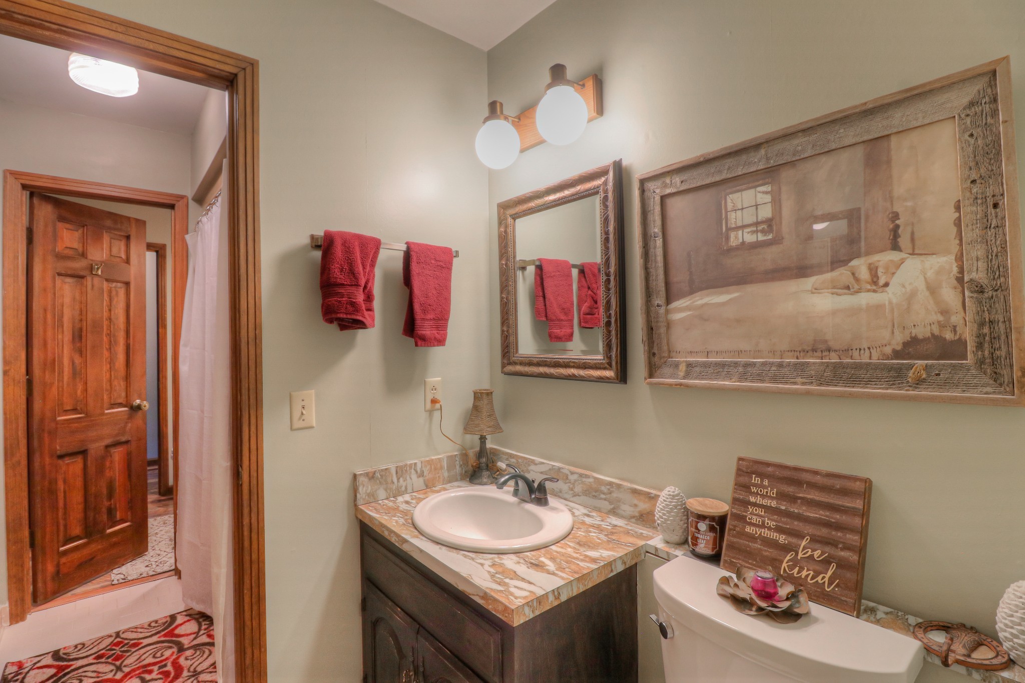 7308 Walker Road Fairview, TN 37062 - Photo 21 of 36 a bathroom with a sink and a mirror