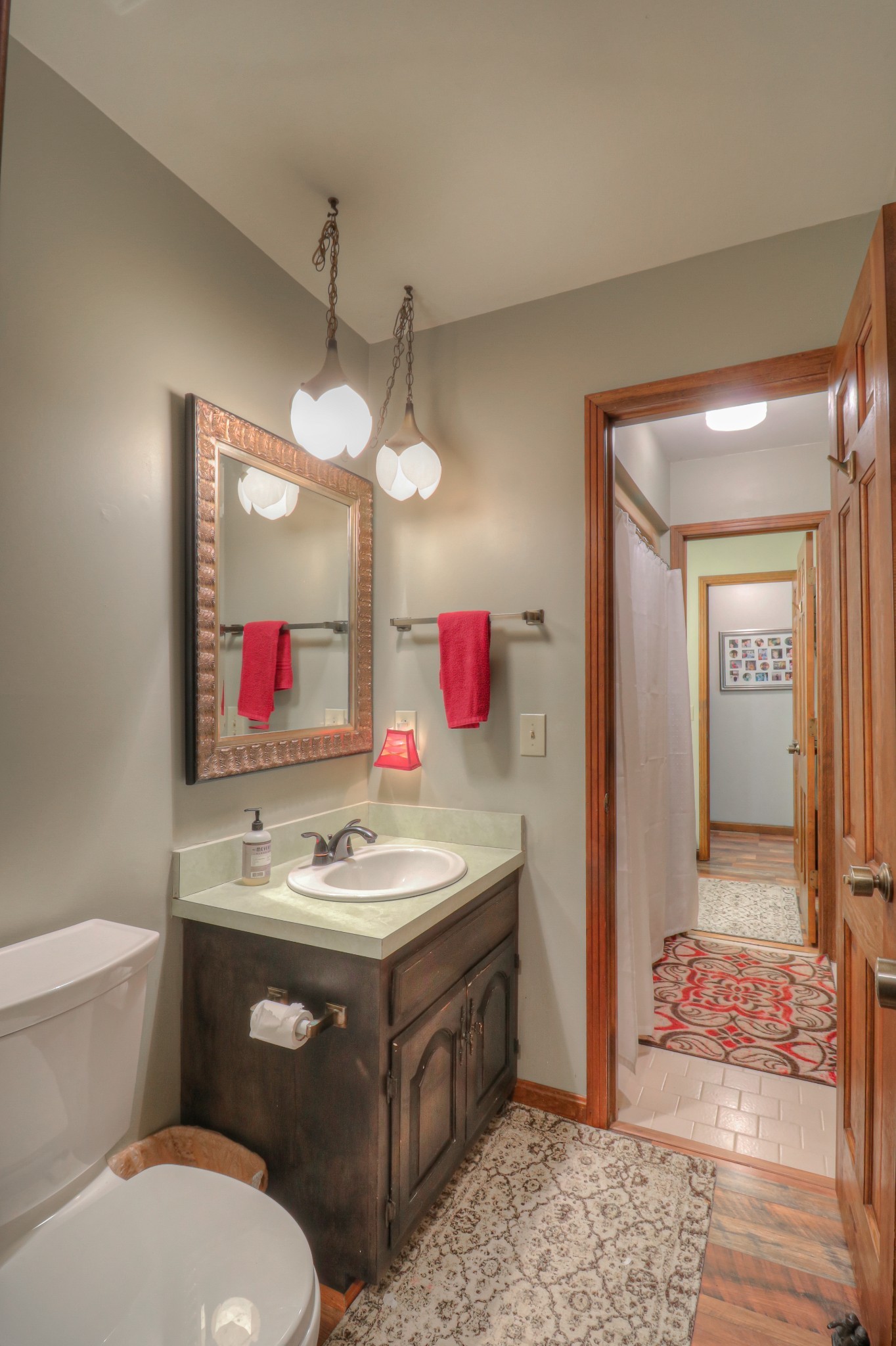 7308 Walker Road Fairview, TN 37062 - Photo 22 of 36 a bathroom with a sink vanity mirror and toilet