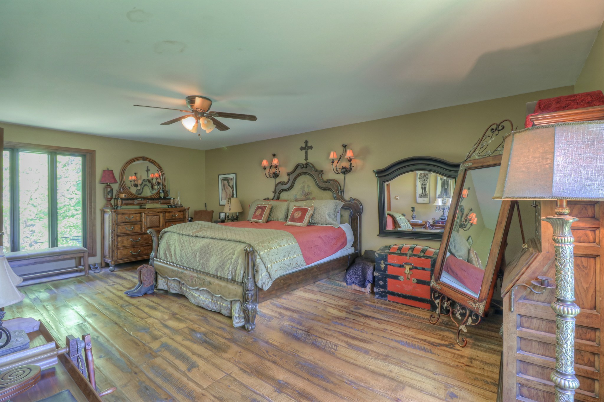 7308 Walker Road Fairview, TN 37062 - Photo 25 of 36 a bedroom with a bed a chandelier and dresser