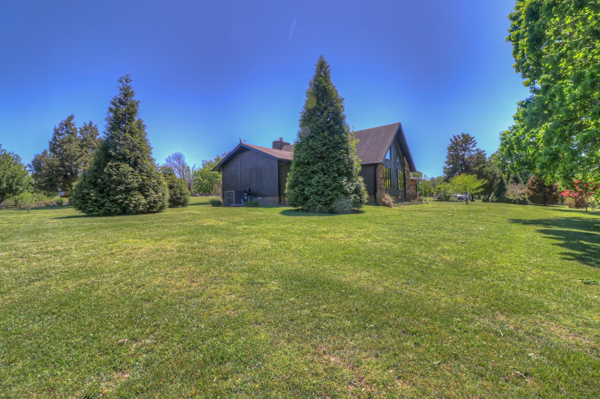 7308 Walker Road Fairview, TN 37062 - Photo 4 of 36 a view of a large garden with large trees