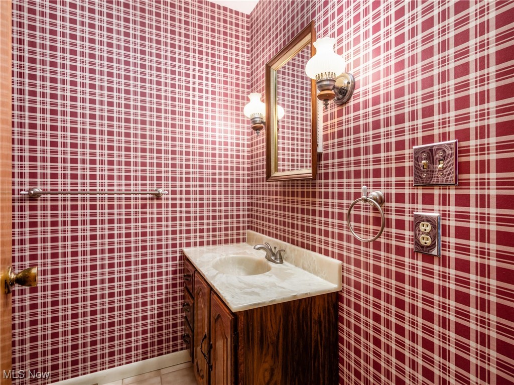 975 Richey Road Zanesville, OH 43701 - Photo 21 of 27 Bathroom with vanity, tile patterned floors, and wallpapered walls