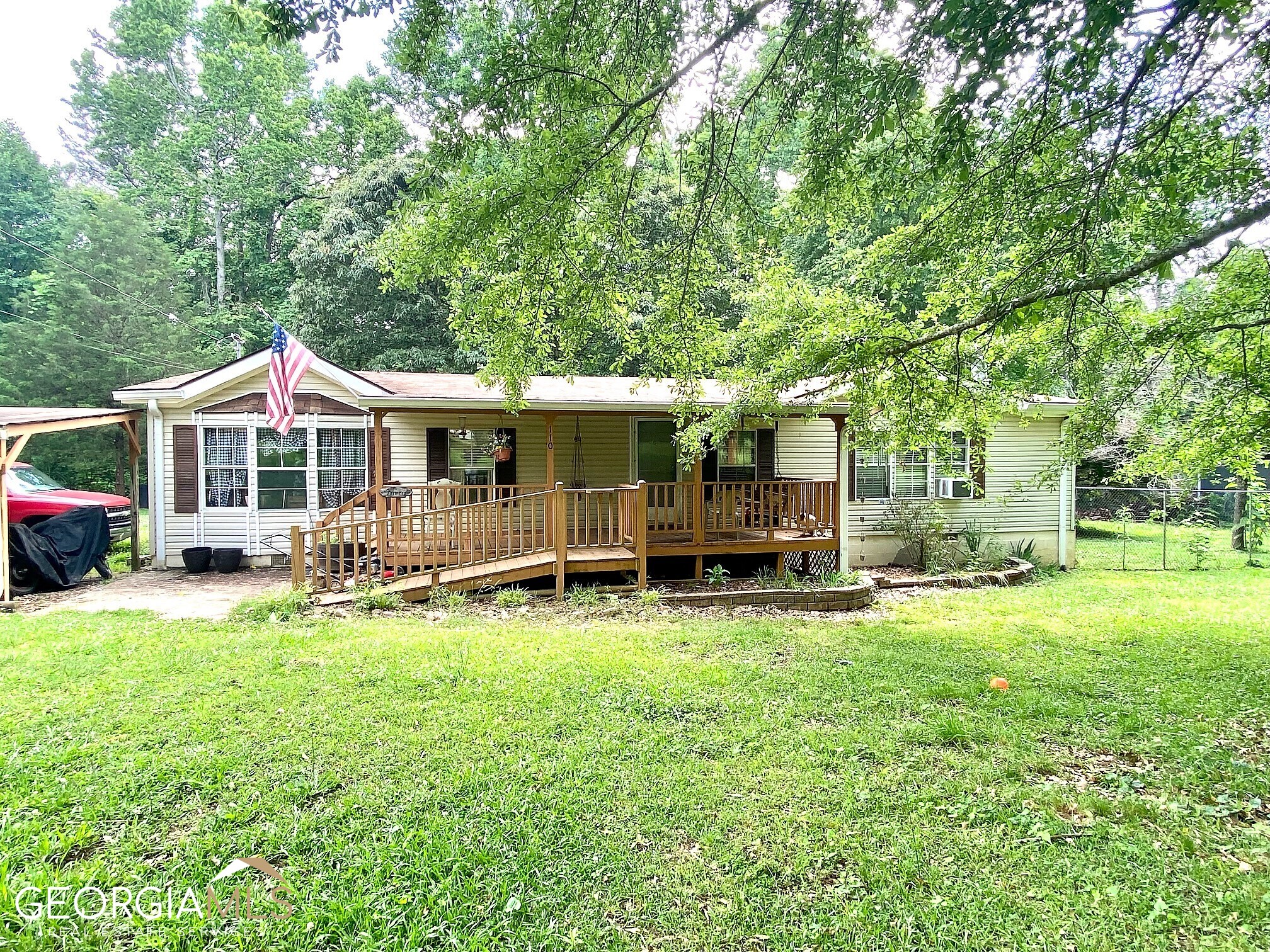 110 Tumlin Creek Road Roopville, GA 30170 - Photo 1 of 1 a front view of a house with yard and sitting area