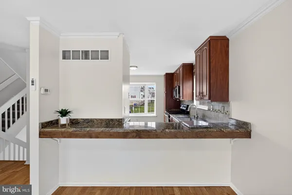 an empty room with closet and a chandelier fan
