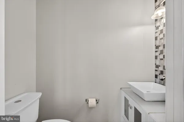 a utility room with sink dryer and washer