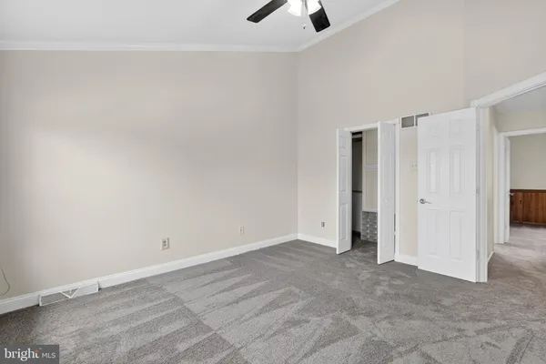 a living room with a fireplace and a wooden floor