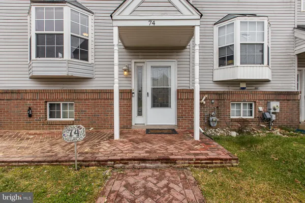 a kitchen with stainless steel appliances granite countertop a stove a refrigerator and a sink