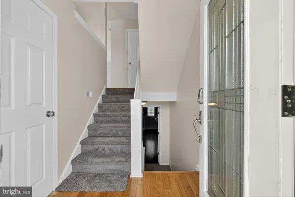 a kitchen with granite countertop stainless steel appliances a refrigerator and a sink