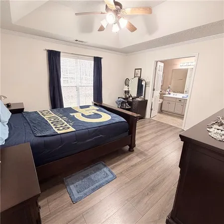 a spacious bathroom with a double vanity sink mirror and toilet
