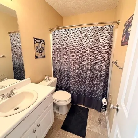 a bedroom with furniture and a chandelier