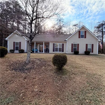a house that has a tree in front of the house
