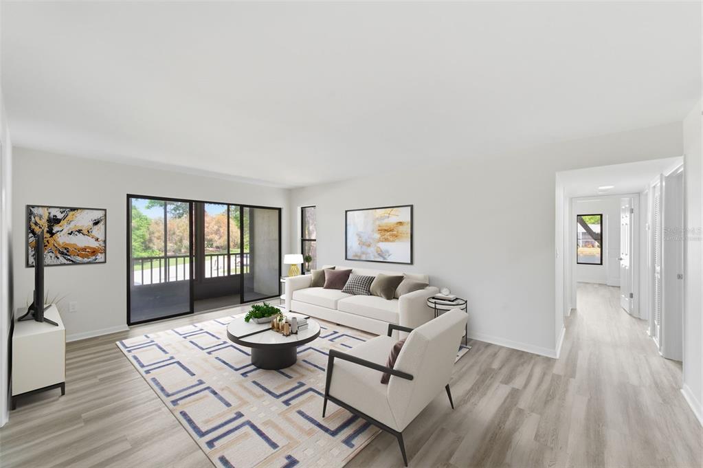 1135 Pine Ridge Circle West, Unit A2 Tarpon Springs, FL 34688 - Photo 11 of 63 a living room with furniture and a window