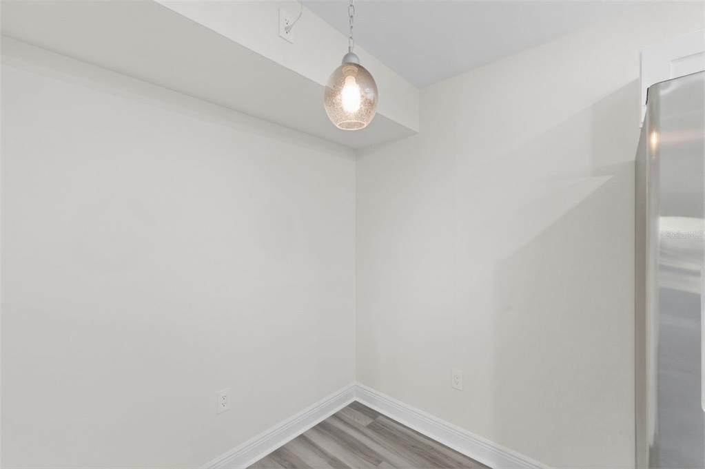 1135 Pine Ridge Circle West, Unit A2 Tarpon Springs, FL 34688 - Photo 13 of 63 a view of a small space with racks on the wall