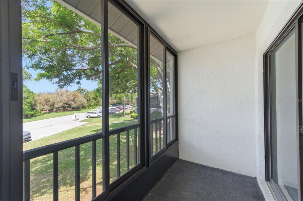 1135 Pine Ridge Circle West, Unit A2 Tarpon Springs, FL 34688 - Photo 22 of 63 a view of a room with a large window
