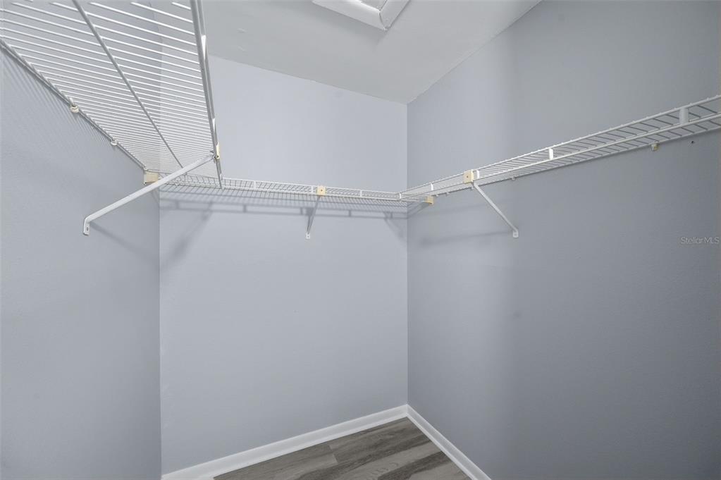 1135 Pine Ridge Circle West, Unit A2 Tarpon Springs, FL 34688 - Photo 28 of 63 a view of a room with racks on the wall