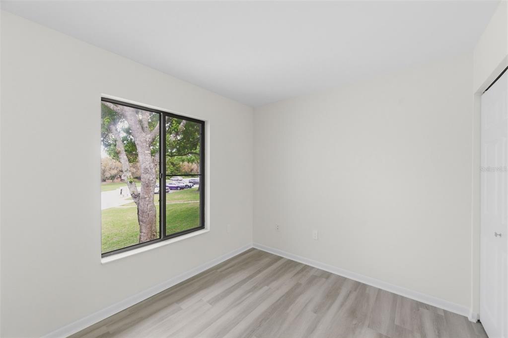 1135 Pine Ridge Circle West, Unit A2 Tarpon Springs, FL 34688 - Photo 31 of 63 an empty room with a window