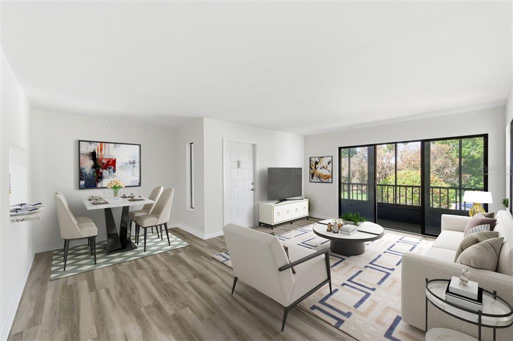 1135 Pine Ridge Circle West, Unit A2 Tarpon Springs, FL 34688 - Photo 9 of 63 a living room with furniture and a wooden floor