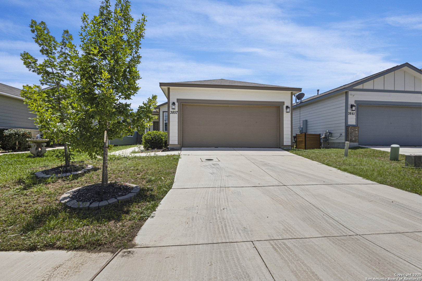 a front view of a house with yard