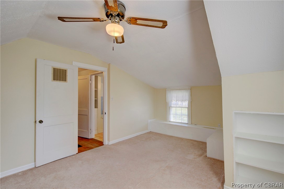 12 Old Meribeth Road Hampton, VA 23669 - Photo 30 of 32 Additional living space featuring light colored carpet, vaulted ceiling, and ceiling fan
