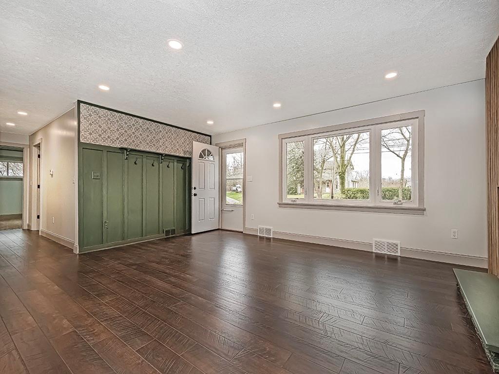 3040 Dutch Ridge Road Beaver, PA 15009 - Photo 5 of 30 an empty room with wooden floor and windows