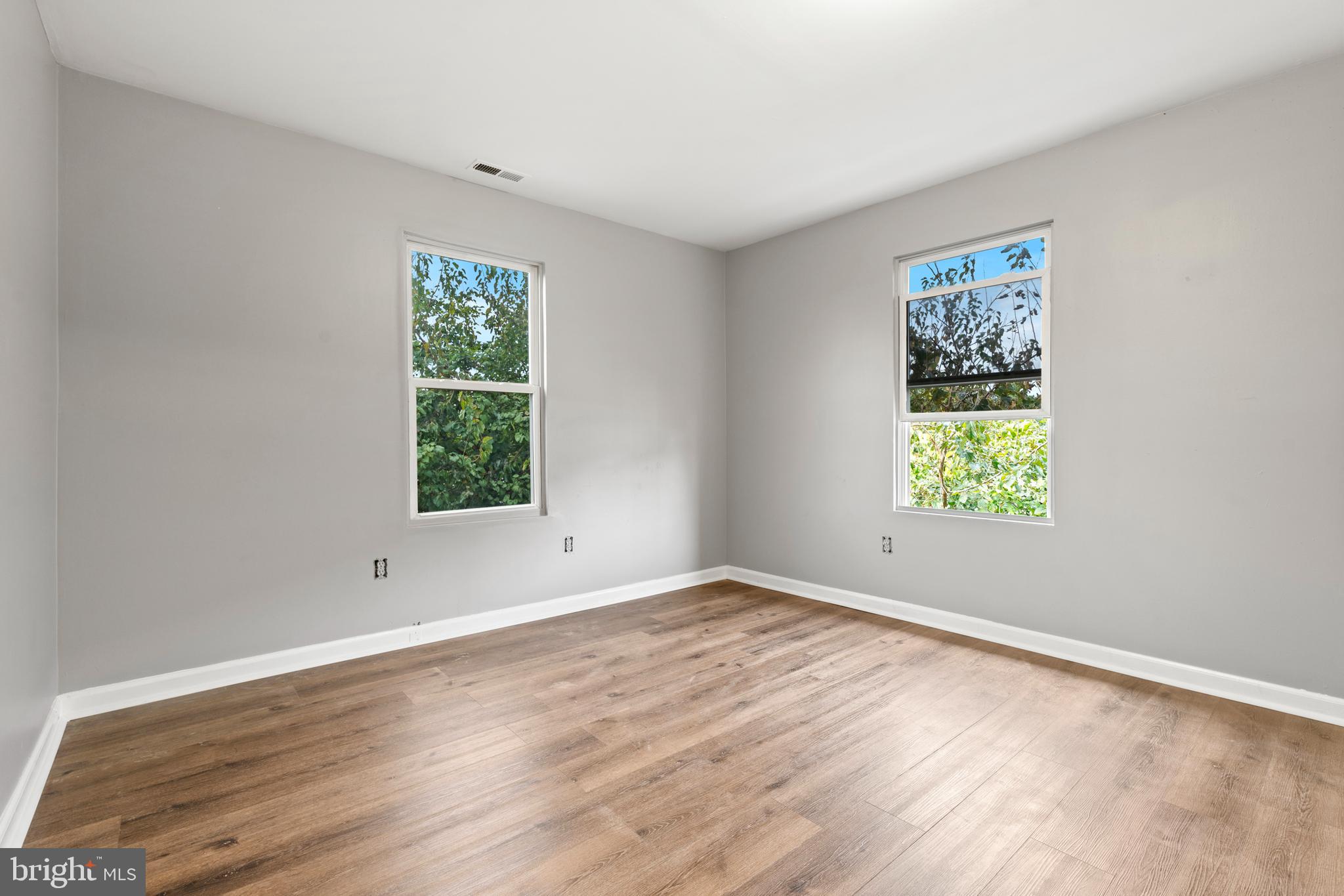4203 Shell Street Capitol Heights, MD 20743 - Photo 16 of 25 a view of an empty room with wooden floor and a window