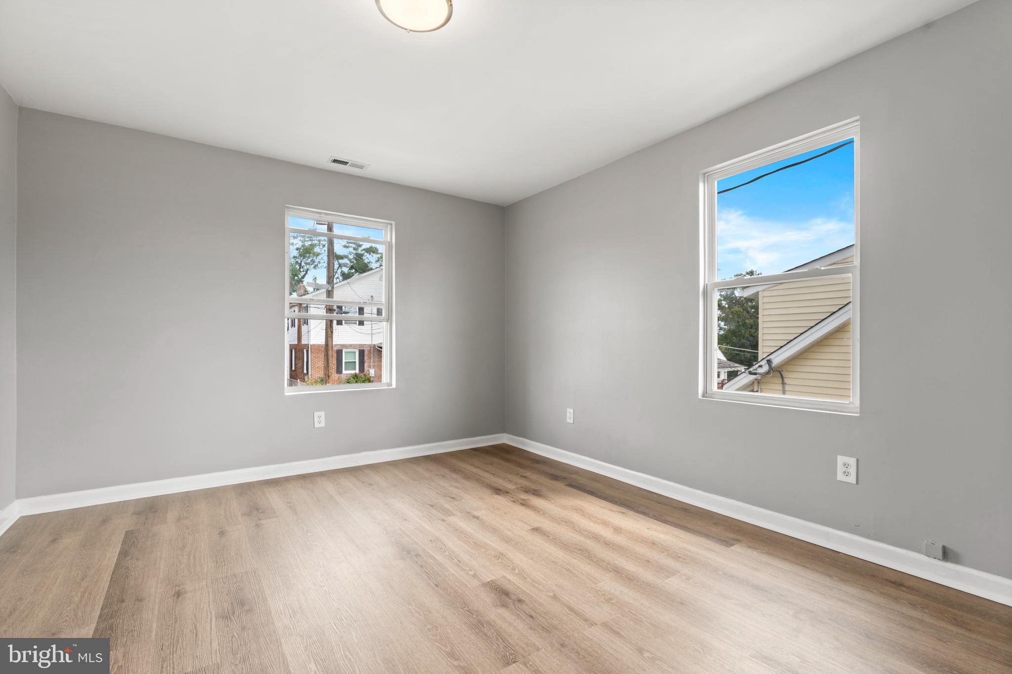 4203 Shell Street Capitol Heights, MD 20743 - Photo 18 of 25 wooden floor in an empty room with a window
