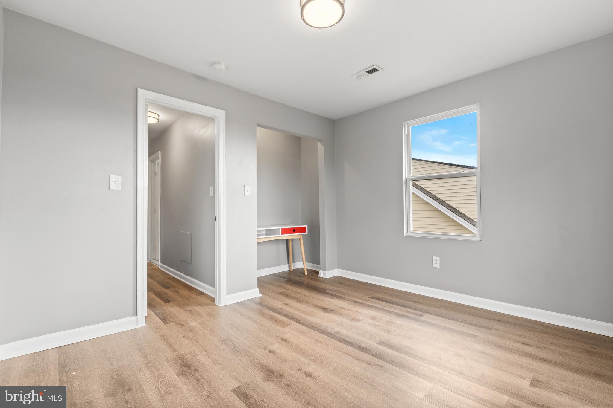 4203 Shell Street Capitol Heights, MD 20743 - Photo 21 of 25 a view of a room with wooden floor and window