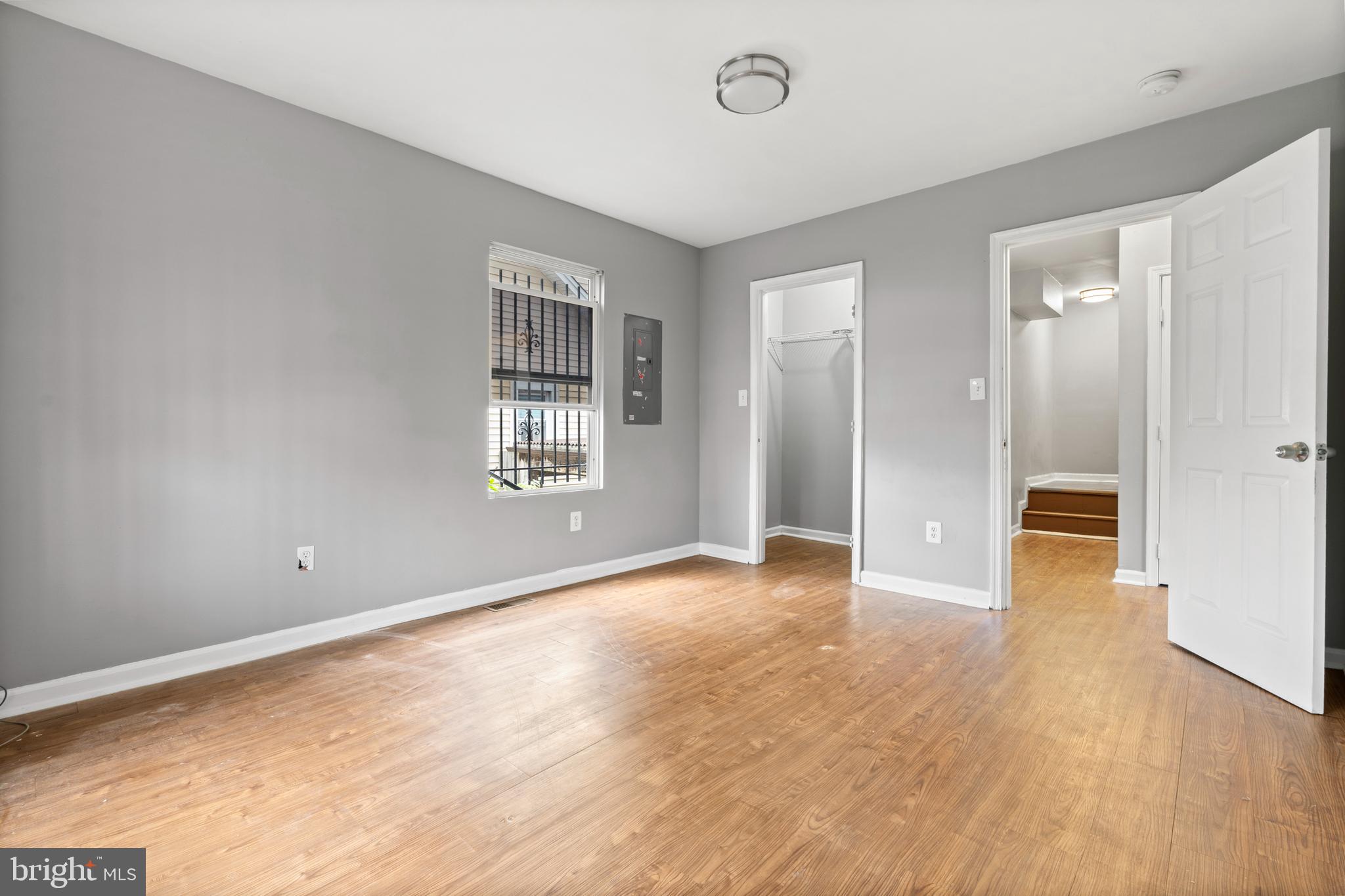 4203 Shell Street Capitol Heights, MD 20743 - Photo 10 of 25 an empty room with wooden floor and windows