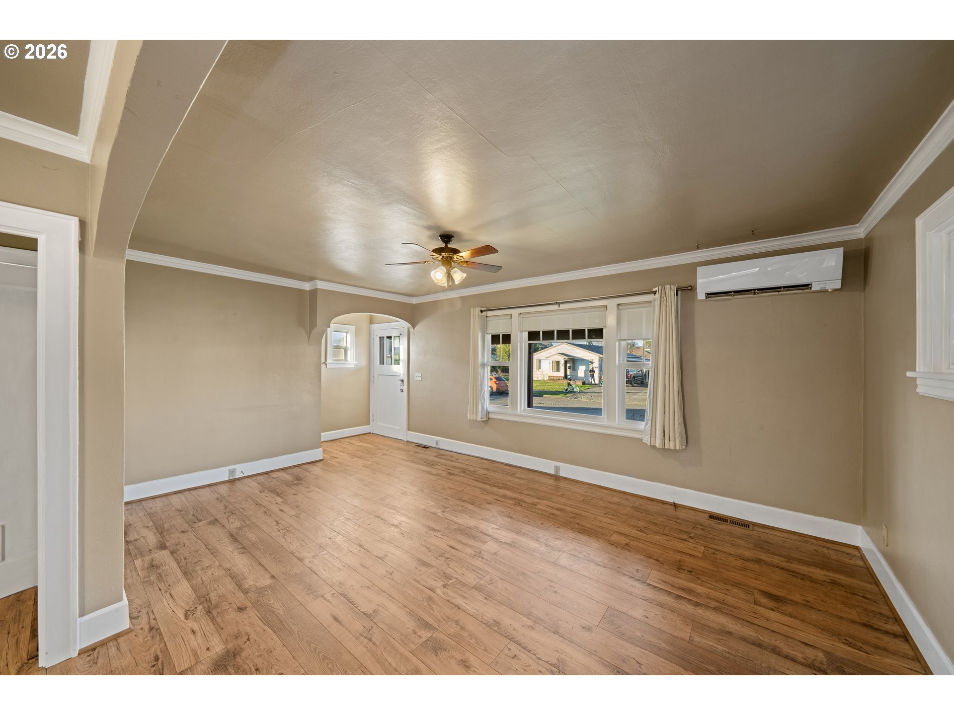 2507 6th Street Tillamook, OR 97141 - Photo 13 of 45 a view of an empty room with window and wooden floor