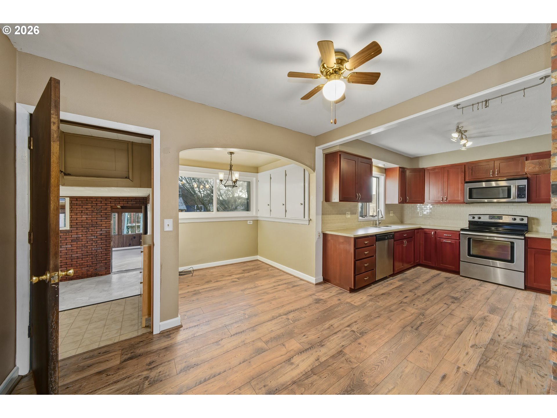 2507 6th Street Tillamook, OR 97141 - Photo 16 of 45 a kitchen with granite countertop stainless steel appliances and wooden cabinets