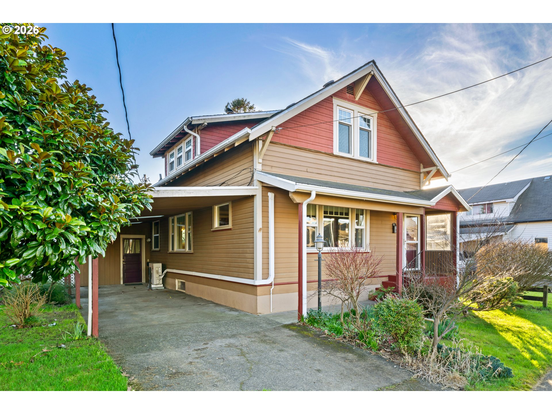 2507 6th Street Tillamook, OR 97141 - Photo 2 of 45 a front view of a house with a yard