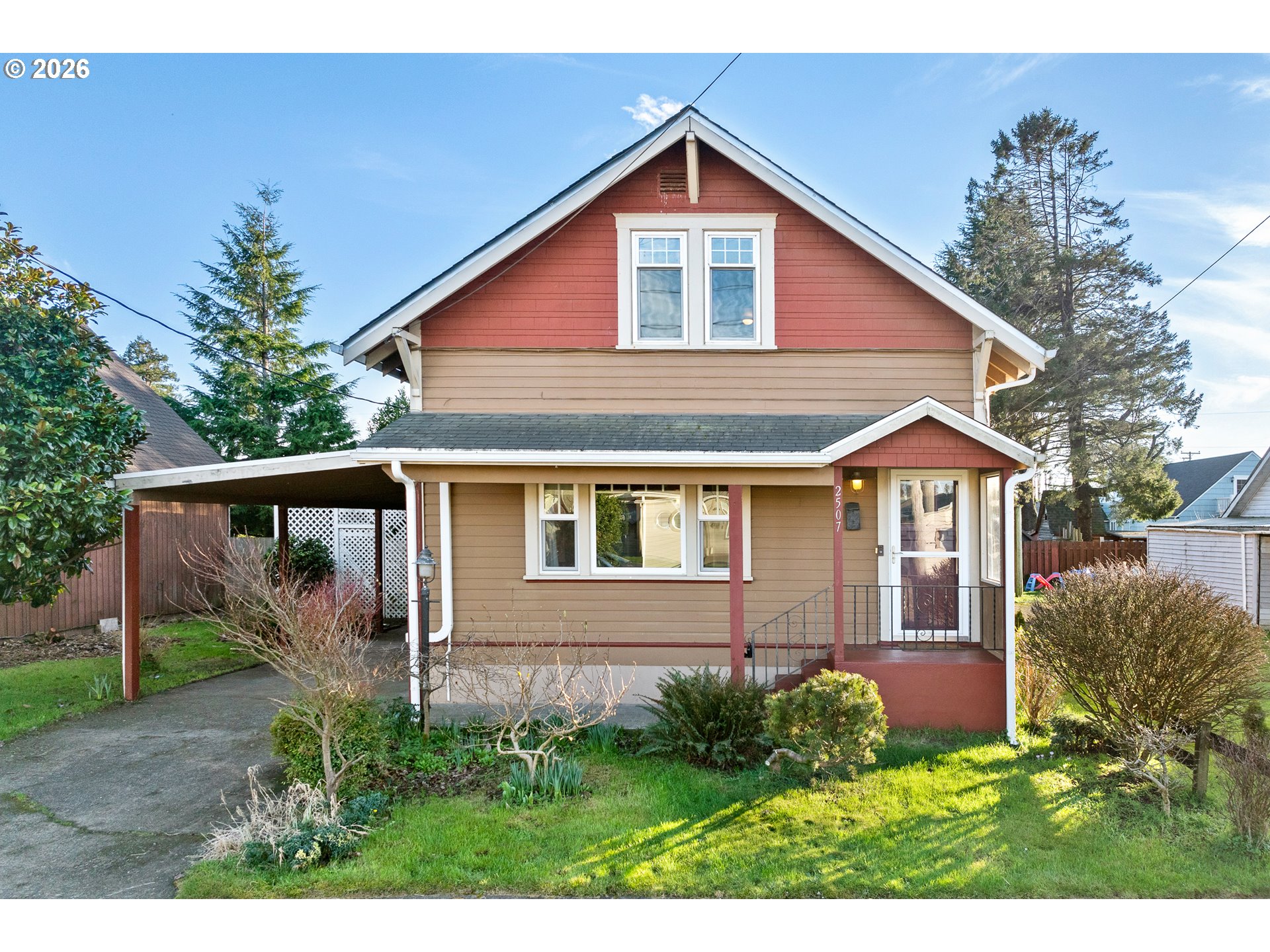 2507 6th Street Tillamook, OR 97141 - Photo 3 of 45 a front view of a house with garden