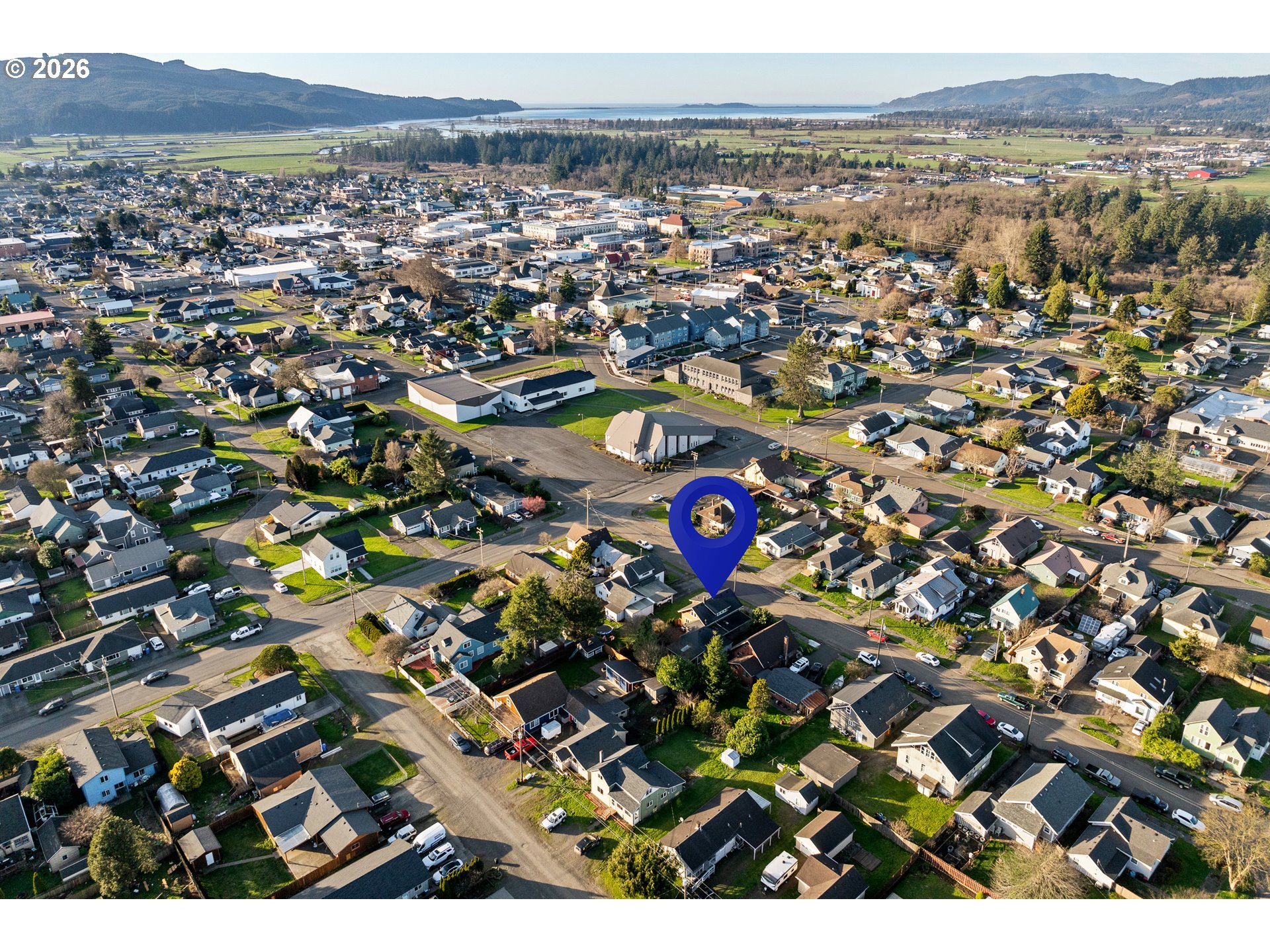 2507 6th Street Tillamook, OR 97141 - Photo 45 of 45 an aerial view of residential houses with outdoor space