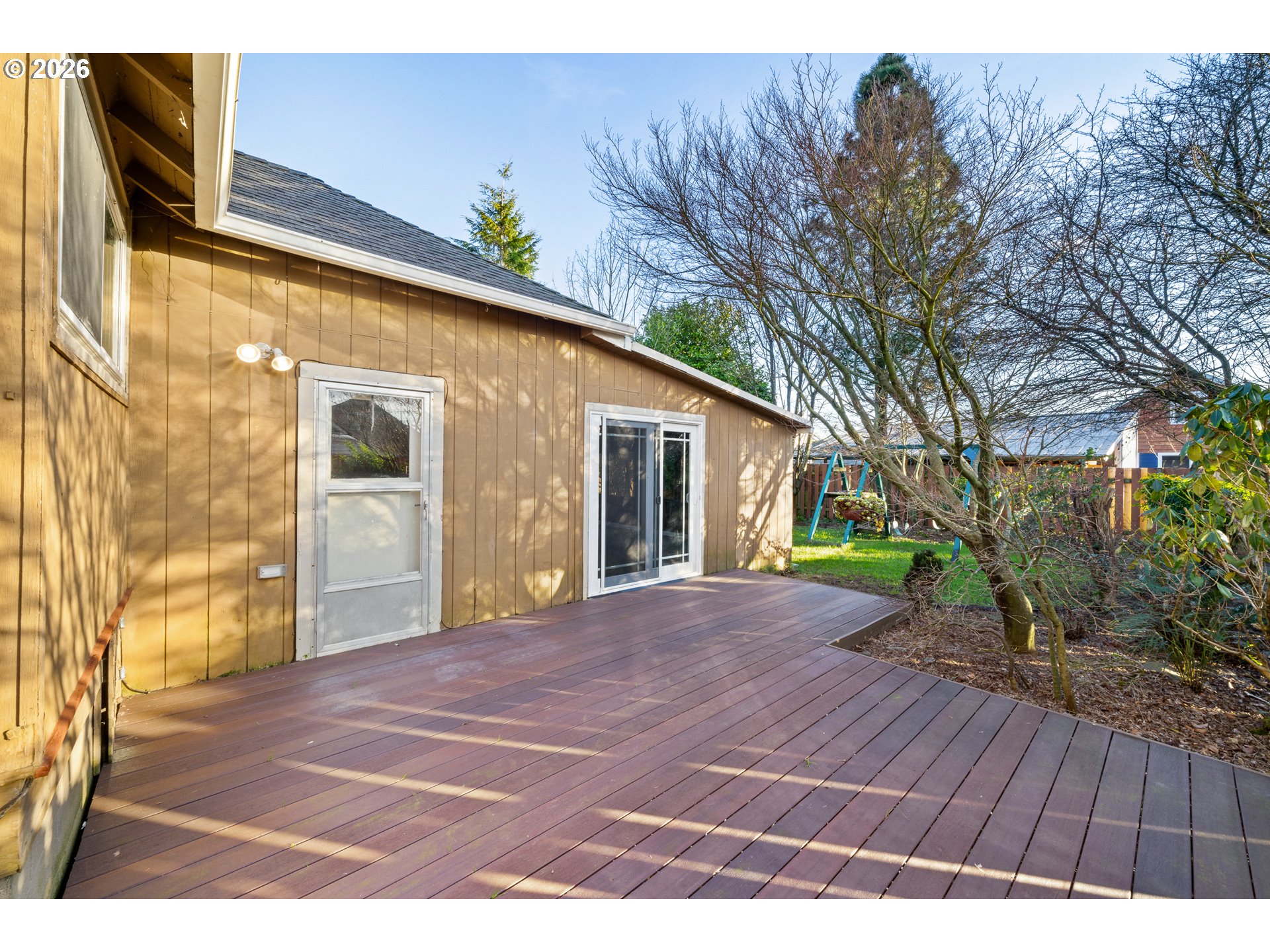 2507 6th Street Tillamook, OR 97141 - Photo 8 of 45 a view of backyard with a garden and trees