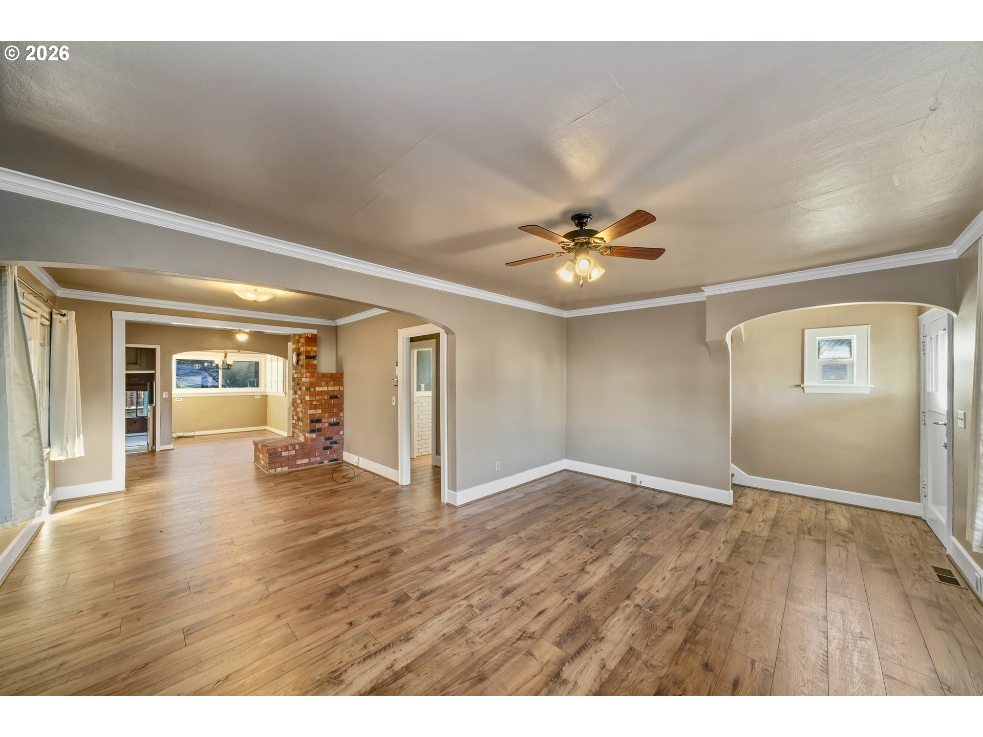 2507 6th Street Tillamook, OR 97141 - Photo 9 of 45 a view of an empty room with window and wooden floor