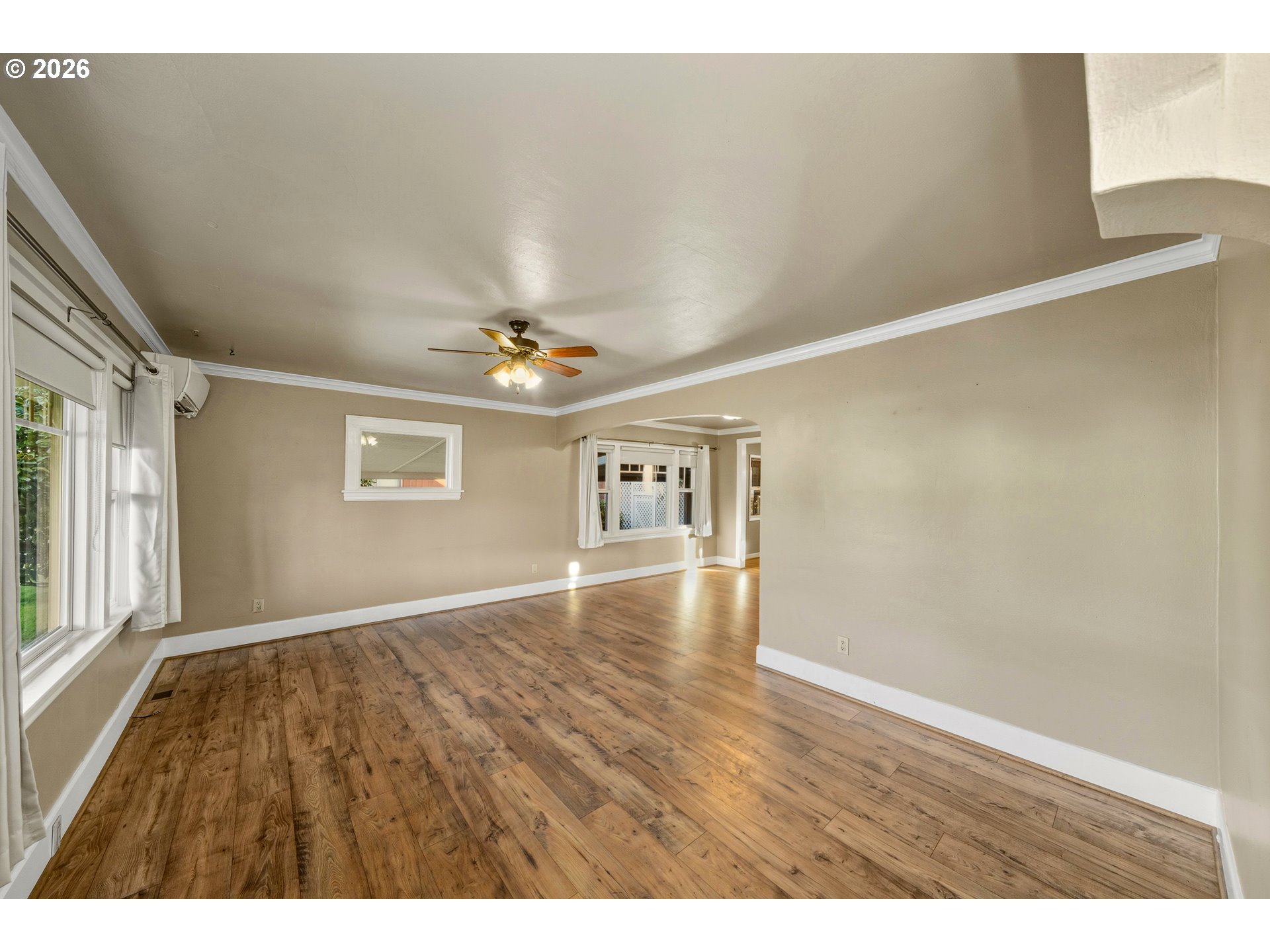 2507 6th Street Tillamook, OR 97141 - Photo 10 of 45 wooden floor in an empty room with a window