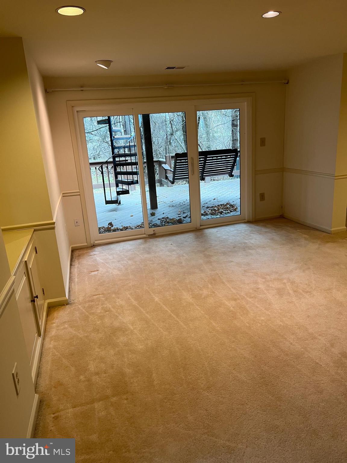 10775 Brewer House Road Rockville, MD 20852 - Photo 14 of 19 a view of an empty room with a fireplace and a window